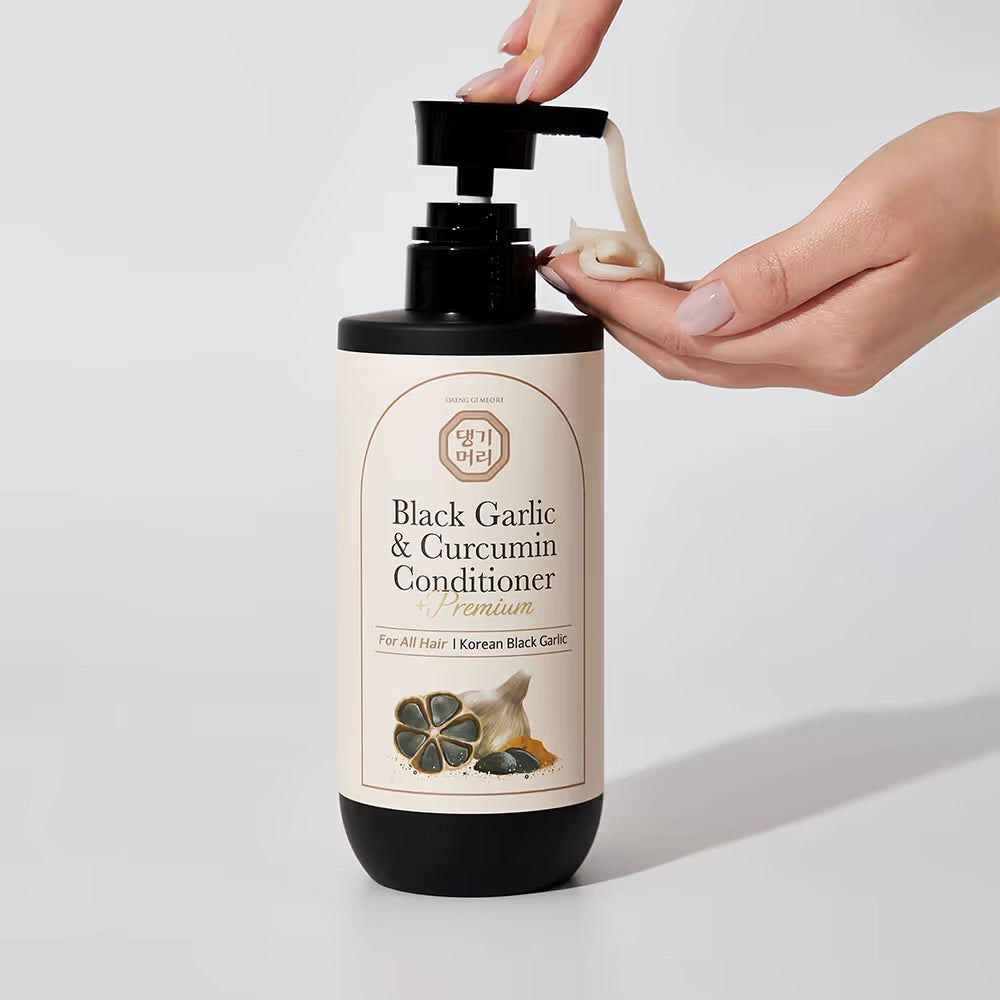 Balzams-maska matiem ar melnā ķiploka un kurkumas ekstraktu Daeng Gi Meo Ri Black Garlic & Curcumin Treatment