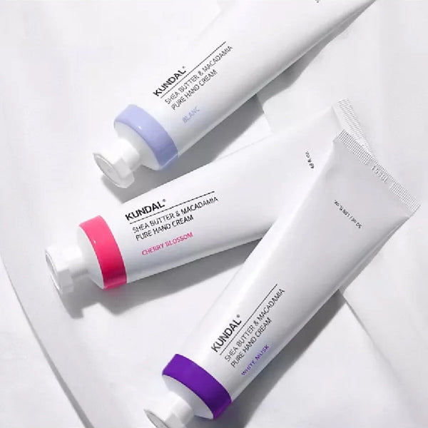 Drėkinamasis rankų kremas su taukmedžio sviestu Kundal Shea Butter & Macadamia Pure Hand Cream Cherry Blossom